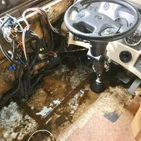 Motorhome Class A - Water Damage to Flooring Drivers Area.